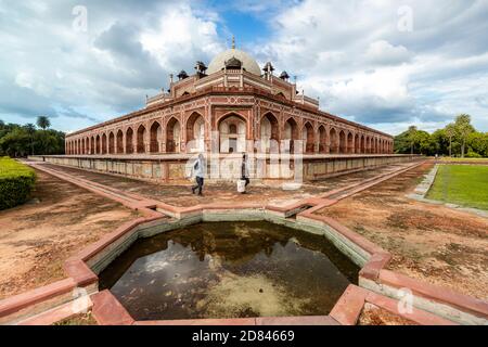 View of the iconic Humayun's tomb in central Delhi against the backdrop of heavy clouds. Stock Photo