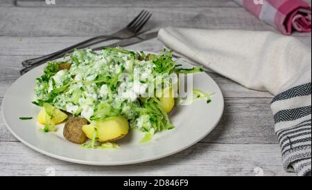 Cottage cheese salad with jacket potatoes Stock Photo