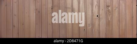 Panorama background with wooden brown boards, rails with texture. Stock Photo