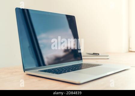 side view. open laptop on the desktop. Stock Photo