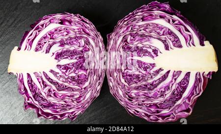 Close up view of fresh cut red cabbage with water drops on dark backgrounds. Copy space. High quality photo Stock Photo