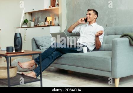 young entrepreneur talking on his smartphone.domestic life. Stock Photo