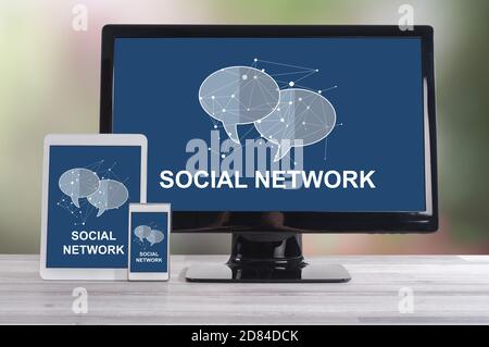 Social network concept shown on different information technology devices Stock Photo