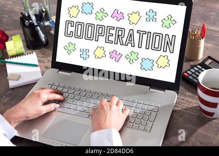 Cooperation concept shown on a laptop screen Stock Photo