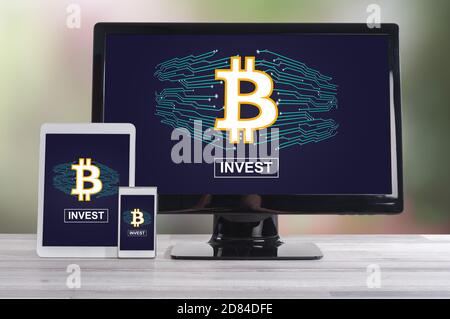 Bitcoin concept shown on different information technology devices Stock Photo