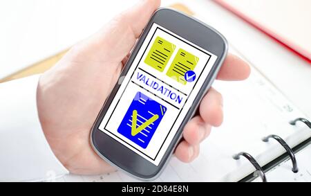 Validation concept shown on a smartphone screen Stock Photo