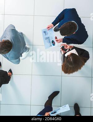 top view. group of employees discussing work issues. Stock Photo