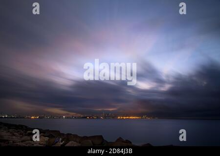 The Coastal Town is Visible in the Distance. Long Exposure of the Night Sky over the Mediterranean Sea. The Delightful Beauty of Lebanon. Stock Photo