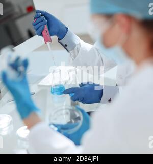 close up. scientists examining liquid samples in the lab. Stock Photo