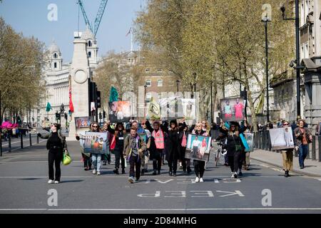 London, United Kingdom, 15th April 2019:- Extinction Rebellion protesters block and march down Whitehall past Downing Street to wards Parliament Squar Stock Photo