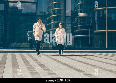 in full growth. medical professionals running to the rescue. Stock Photo