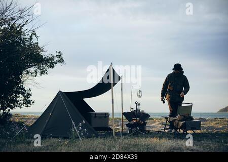 Japanese man solo camping Stock Photo - Alamy