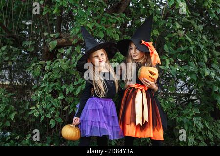 Two little girls at Halloween party having fun outdoor Stock Photo