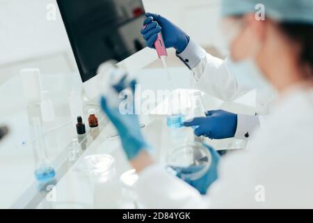 close up. scientists examining liquid samples in the lab. Stock Photo