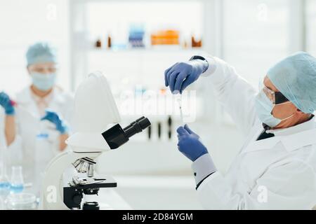 close up. scientist microbiologist working in the laboratory. Stock Photo