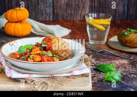 Chorizo and butterbean stew with baked jacket potato Stock Photo