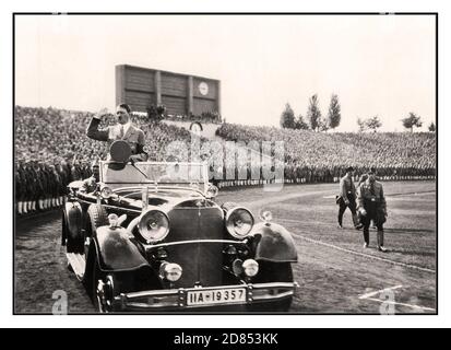 1930's Adolf Hitler at a Hitler Youth Rally Nuremberg in his open top Mercedes Motorcar in 1935. NSDAP Reichs Party Convention of Freedom  Nuremberg 10th-16th September 1935 Stock Photo