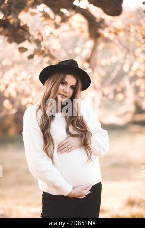 Close up of pregnant woman wearing pregnancy corset against