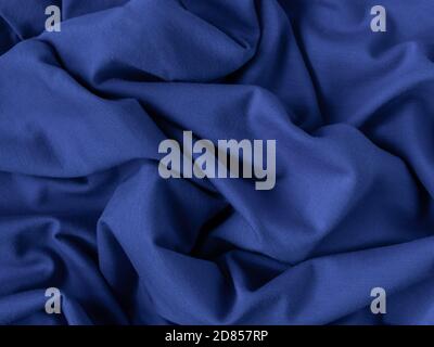 classic blue fabric sample. fabric texture, folds, closeup. selective focus Stock Photo