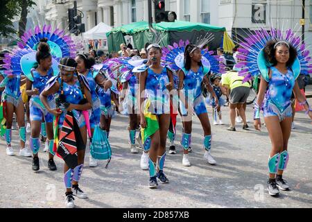 London, United Kingdom, August 25th 2019:- A group of performers at the Notting Hill Carnival in West London, the Notting Hill Carnival is Europe's la Stock Photo