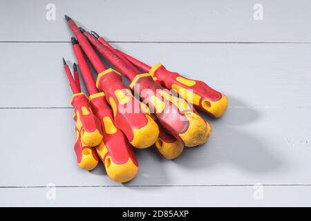 A set of a lot of different red tools for working include hammer screwdriver on gray background Stock Photo