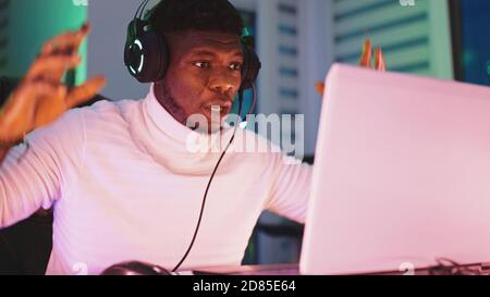 Portrait shot of disappointed young black man professional game player losing in video game. High quality photo Stock Photo