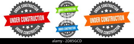 under construction sign. round ribbon label set. Stamp Stock Vector