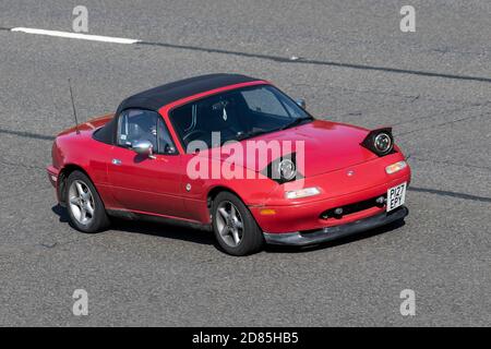 1997 red 90s nineties Mazda Mx-5 MX5 Vehicular traffic, moving vehicles, cars, vehicle driving on UK roads, motors, motoring on the M6 motorway highway UK road network. Stock Photo