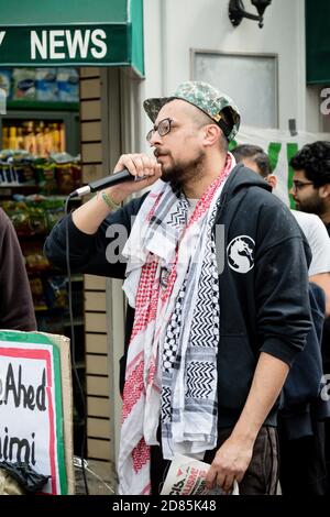 Demonstrators gather near a Palestinian flag during a protest in Lyon ...