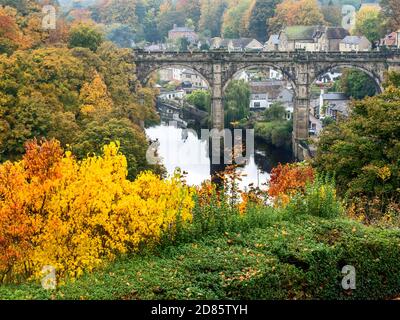 Historic railway viaduct over the River Nidd in autumn at Knaresborough North Yorkshire Yorkshire England Stock Photo