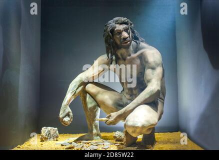 Life-sized sculpture of Homo heidelbergensis. He is