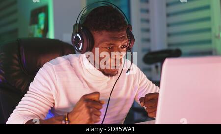 Portrait shot of disappointed young black man professional game player losing in video game. High quality photo Stock Photo