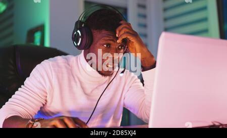 Portrait shot of disappointed young black man professional game player losing in video game. High quality photo Stock Photo