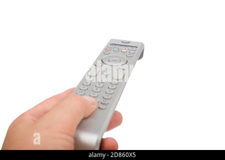 Male hand changing channel with remote control isolated. Stock Photo