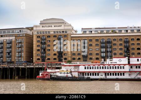 UK, London, Butlers Wharf riverside warehouse converted to upmarket housing beside River Thames Stock Photo