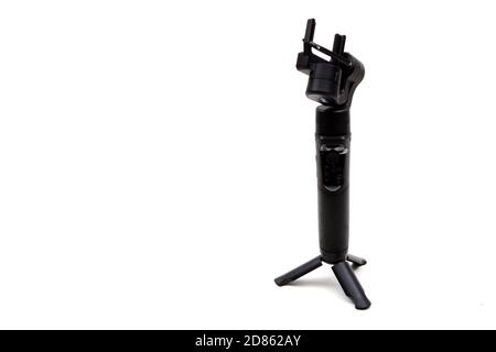 London, United Kingdom, 21st September 2020:- An isteady gimbal isolated on a white background Stock Photo