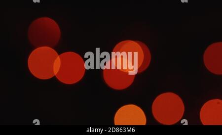 blurred dull Christmas lights light up slowly and fade out deep bokeh backdrop Stock Photo
