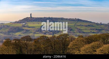 The Victoria or Jubillee Tower on top of Castle Hill, an ancient iron Age Hill Fort, near Almondbury, Huddersfield, seen from Farnley Tyas Stock Photo