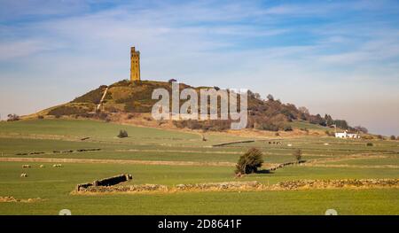 The Victoria or Jubillee Tower on top of Castle Hill, an ancient iron Age Hill Fort, near Almondbury, Huddersfield, seen from Farnley Tyas Stock Photo