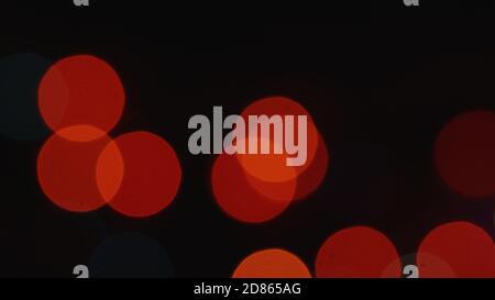 dull flickering Christmas lights bokeh backdrop of blurring multicolored lights Stock Photo