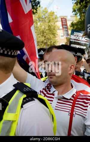 London, United Kingdom, August 31st 2019:- Pro Brexit supporters march through central London escorted by the police to counter protest anti Brexit pr