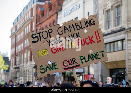 London, United Kingdom, 20th September 2019:- Climate Change Protesters gather in Westminster, central London near the British Parliament as part of a Stock Photo