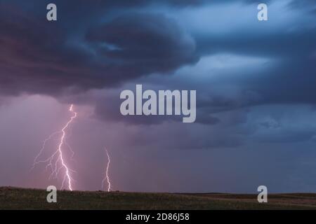 A pair of lightning bolts strike from a thunderstorm cloud near Springview, Nebraska Stock Photo