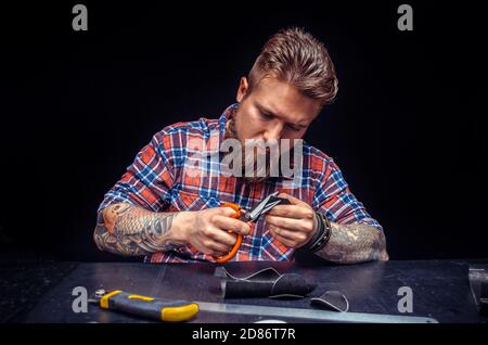 Tanner creating a new leather product Stock Photo