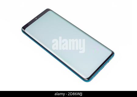 Generic green 2020 year smartphone with curved screen and teardrop front camera - isolated on white background Stock Photo