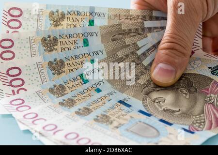 A fan of Polish five hundred zloty banknotes held in the hand Stock Photo