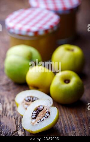 fresh quince on dark wood Stock Photo