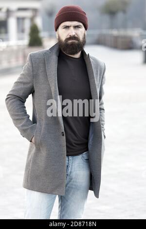 Hipster outfit and hat accessory. Stylish casual outfit spring season.  Menswear and male fashion concept. Man bearded hipster stylish fashionable  coat and hat. Comfortable outfit. Lumbersexual style - Stock Image -  Everypixel