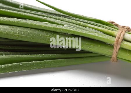 Chives bunch close up isolated on white background, close up Stock Photo