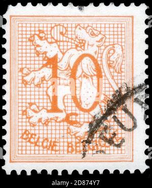 Saint Petersburg, Russia - September 18, 2020: Stamp printed in the Belgium with the image of the Number 10 on Heraldic Lion, circa 1951 Stock Photo